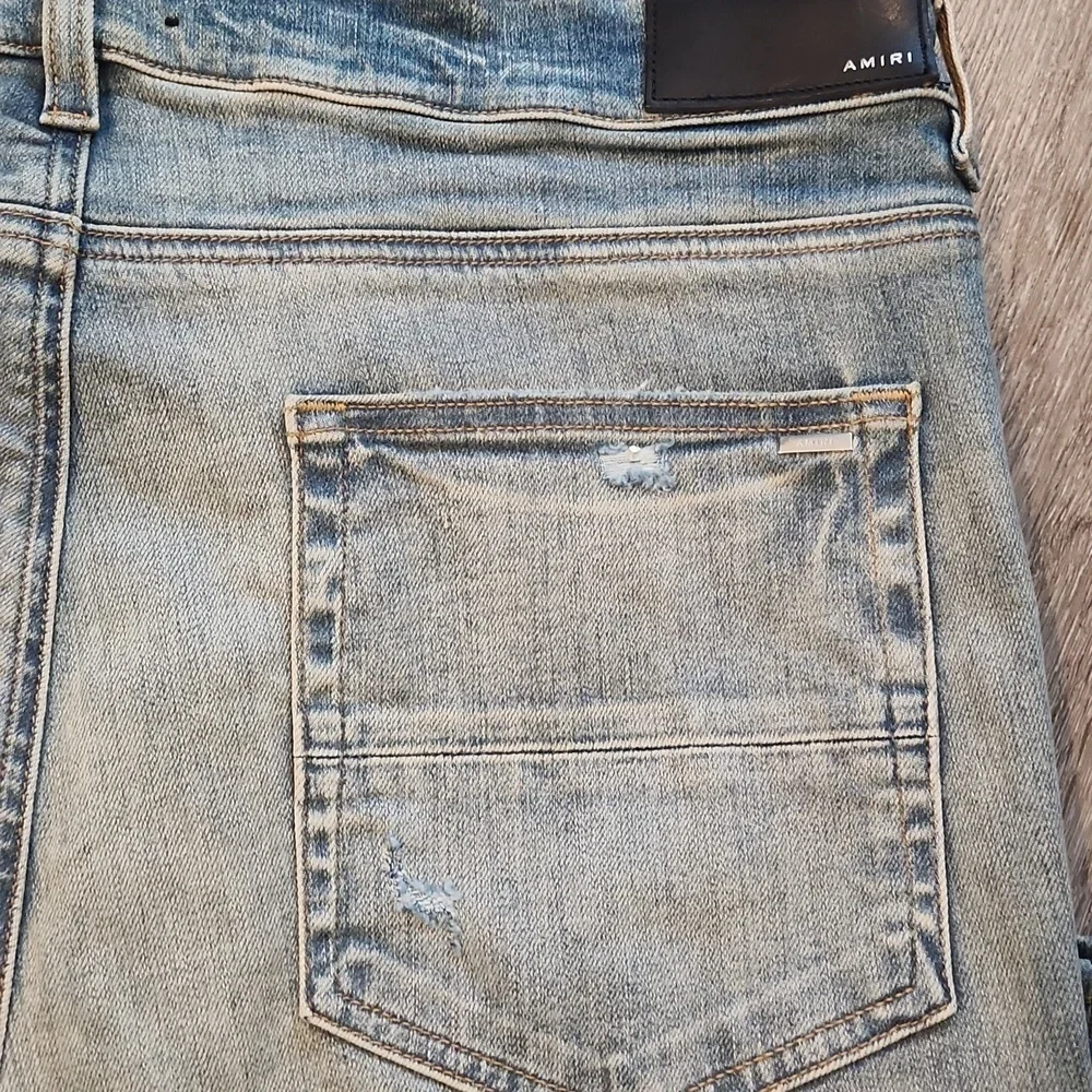 AMIRI Blue and White Skinny Jeans with Distressed Details